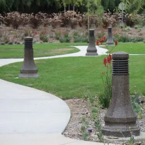 Belmont Bollard - Concrete Multiple lit Belmont style bollards finished with one of our signature concrete décor colors – Midnight Lace.