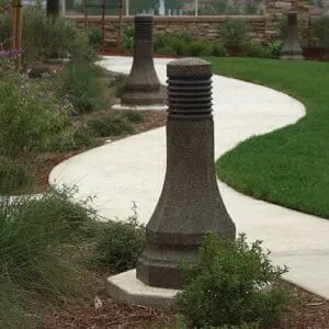 Belmont Bollard - Concrete Multiple lit Belmont style bollards finished with one of our signature concrete décor colors - Midnight Lace.