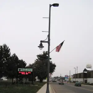 A K366 Harbor Side fixture accompanied by a Marina style arm, banner arms, and a flag mount all on a Kensington pole. Project is in Pine City, Minnesota.