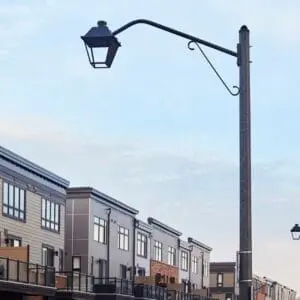 K601D Coach Lantern - Hexagonal Tapered - Grimsby, Ontario A K601D Coach Lantern fixture accompanied by Coach Lantern style arms on top of a Hexagonal Tapered pole. This project is in Grimsby, Ontario.