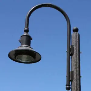 K723 Falconridge Jr. - Fluted Tapered A K723 Falconridge Jr. fixture accompanied by a Bishop Crook style arm on top of a Fluted Tapered pole.
