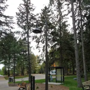 A K806 Satellite Sr. fixture accompanied by a Marina style arm all on a Round Tapered pole.