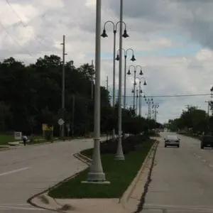 A K208 Moderne fixture accompanied by Wisconsin style arms on a Kensington pole.