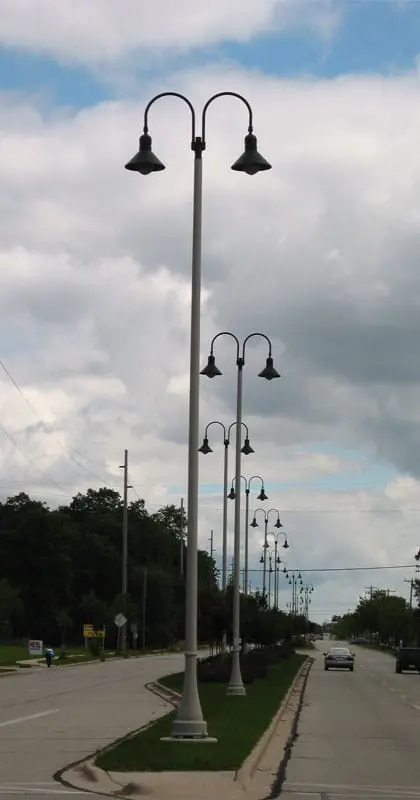 A K208 Moderne fixture accompanied by Wisconsin style arms on a Kensington pole.