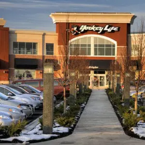 Martello Square Bollard- Concrete - Kitchener, Ontario Multiple lit Martello Square style bollards finished with one of our signature concrete décor colors – Pearl Gray. This project is located outside of a Hockey Life in Kitchener, Ontario.