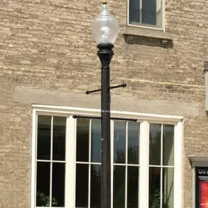 A K118 Washington fixture accompanied by banner arms on a Memphis pole. This project is outside the Town Hall 1873 Theatre in Port Perry, Ontario.