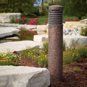 A lit Silhouette style bollard finished in one of our signature concrete décor colors- Vintage Brown.