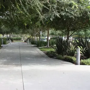 Multiple lit Silhouette bollards finished with one of our signature concrete décor colors - Ash White.