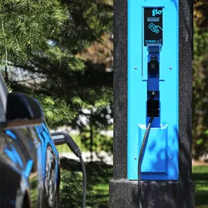VoltLock EV Charger A black car utilizing some of the features offered by the VoltLock EV Charger pole.