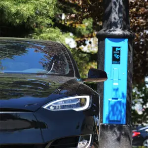 VoltLock EV Charger A black car utilizing some of the features offered by the VoltLock EV Charger pole.