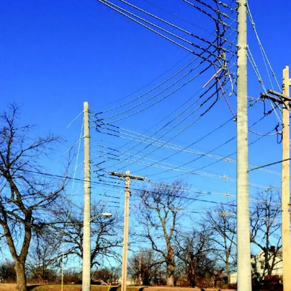 Image shows a few of StressCrete pre-stressed spun concrete poles installed to Kansas City's electrical system. With Kansas City's Board of Public Utilities continuously seeking ways to improve upon their electrical system, the BPU decided to upgrade their system with StressCrete's pre-stressed concrete poles due to their long service life, no maintenance, and lifetime warranty.