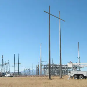 Utility Pole - H Structure A spun concrete utility pole with an 'H Structure' application. This project is near a high voltage area.