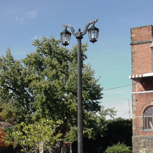 K56 Cleveland fixtures accompanied by Santiago style arms all on top of a Classic style pole.