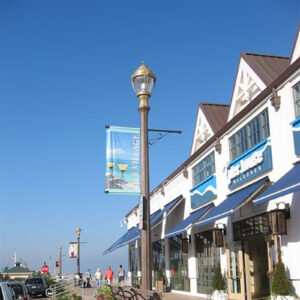 A K134 York fixture accompanied by banner arms all on a Talisman pole. This project is in Piers Village, New Jersey.