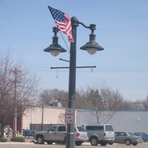 K203 Falconridge fixtures accompanied by banners arms, flowerpot holders, and flag mount all on Classic pole.