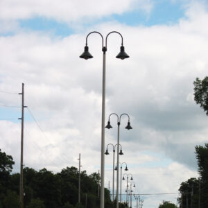 K208 Moderne fixtures accompanied by Wisconsin style arms on a Kensington pole.