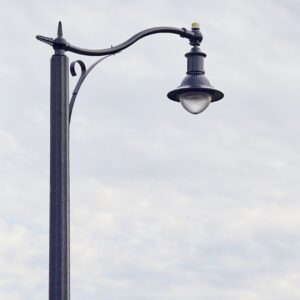 A K211 Manchester fixture accompanied by scroll arm on a Washington pole. Project is located in Grimsby, Ontario.