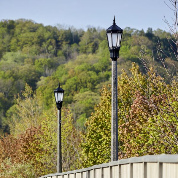 A K56 Cleveland fixture accompanied by banner arms on an Octagonal Tapered pole. Project is in Grimsby, Ontario.