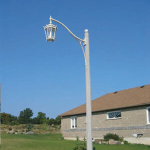 K56 Tudor fixture accompanied by a Scroll style arm all on a Washington style pole.