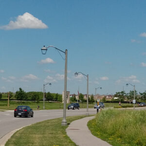 A K601D Coach Lantern accompanied by the Coach Lantern arm all on top of a Belmont style pole. This project is in Oakville, Ontario.