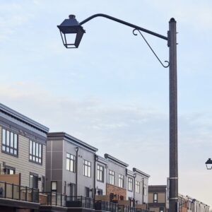 K601D Coach Lantern fixture accompanied by Coach Lantern style arms all on top of an Alexander style pole. This project is in Grimsby, Ontario.