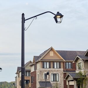 K601D Coach Lantern fixture accompanied by Coach Lantern style arms all on top of an Alexander style pole. This project is in Grimsby, Ontario.