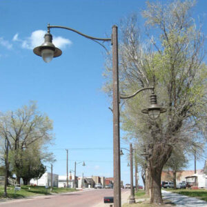 K707 Doral Jr. fixtures accompanied by scroll style arms all on top of a Belmont style pole.