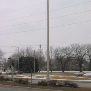 A K208 Moderne fixture accompanied by Wisconsin style arms on a Kensington pole.