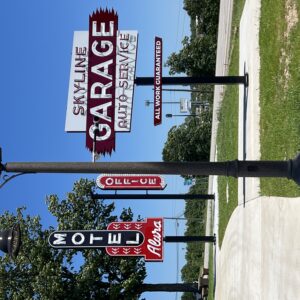 A K729 Aurora Jr. accompanied by a KA40 Mini Scroll with Decorative Scroll arm all on top of a Canterbury pole. This project is located at Neon park in St. Roberts, Missouri.