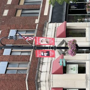 A K803 Solitaire Sr. fixture accompanied by a KA15 Bishop's Crook arm all on top of a round non-tapered metal pole and KSB16 Florentine Sr. base plate. This project is located on Main Street in Logan, Ohio.