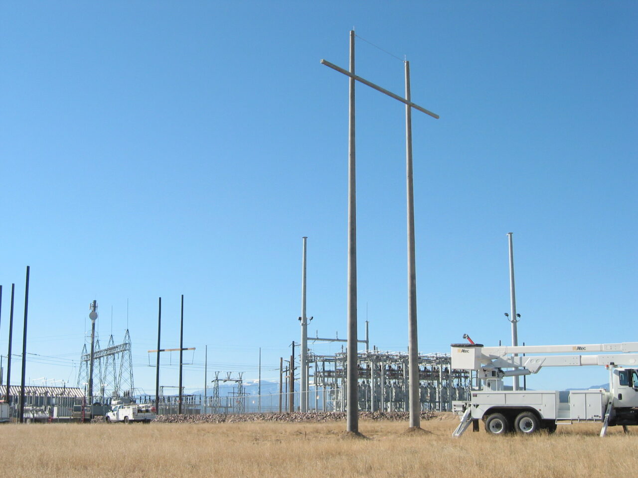 Utility Pole - H Structure A spun concrete utility pole with an 'H Structure' application. This project is near a high voltage area.