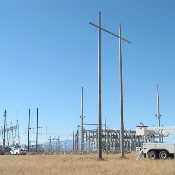 A spun concrete utility pole with an 'H Structure' application. This project is near a high voltage area.